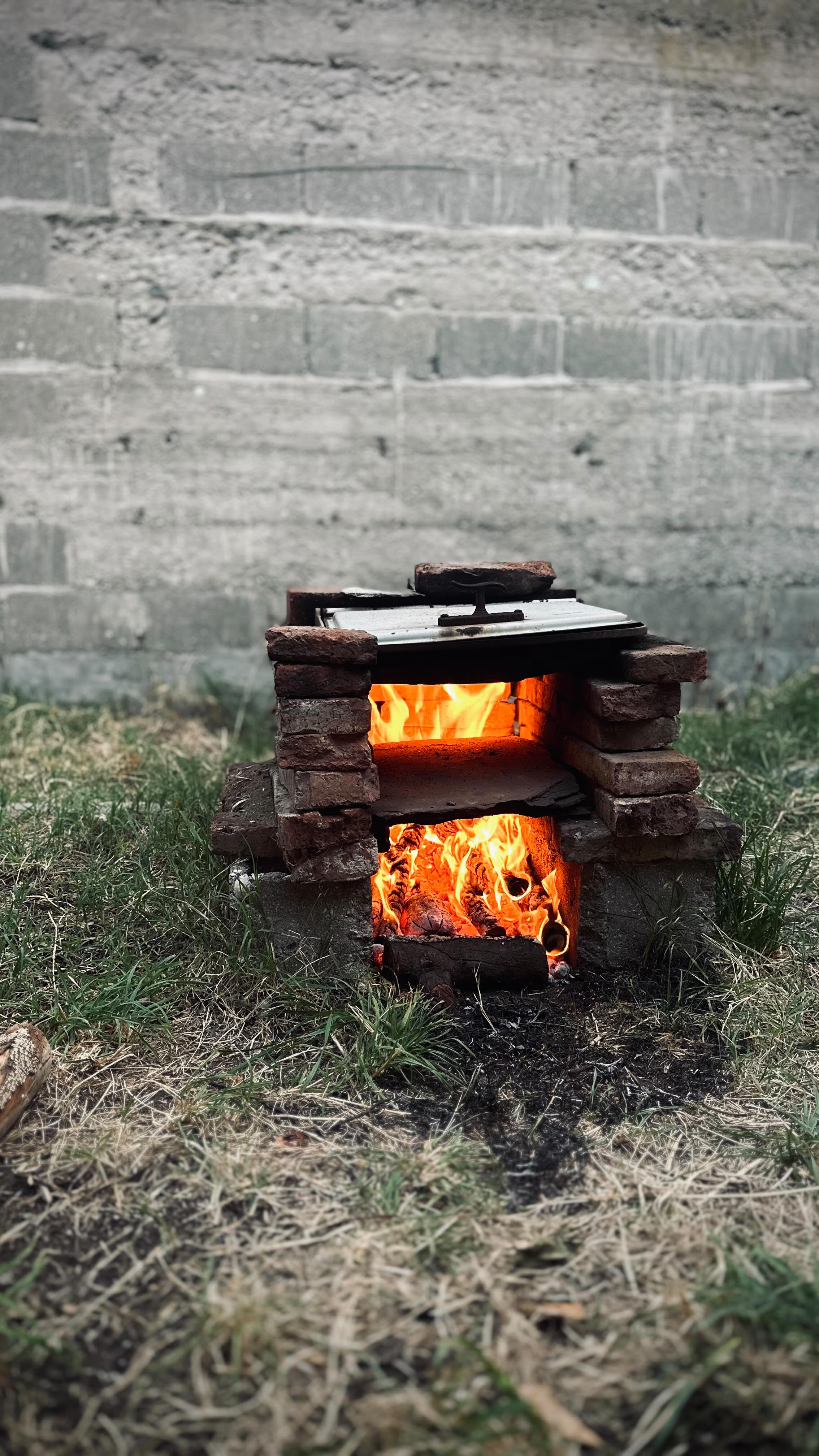 Chef tending to the fire